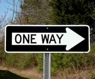 Black and white ONE WAY sign with an arrow pointing right